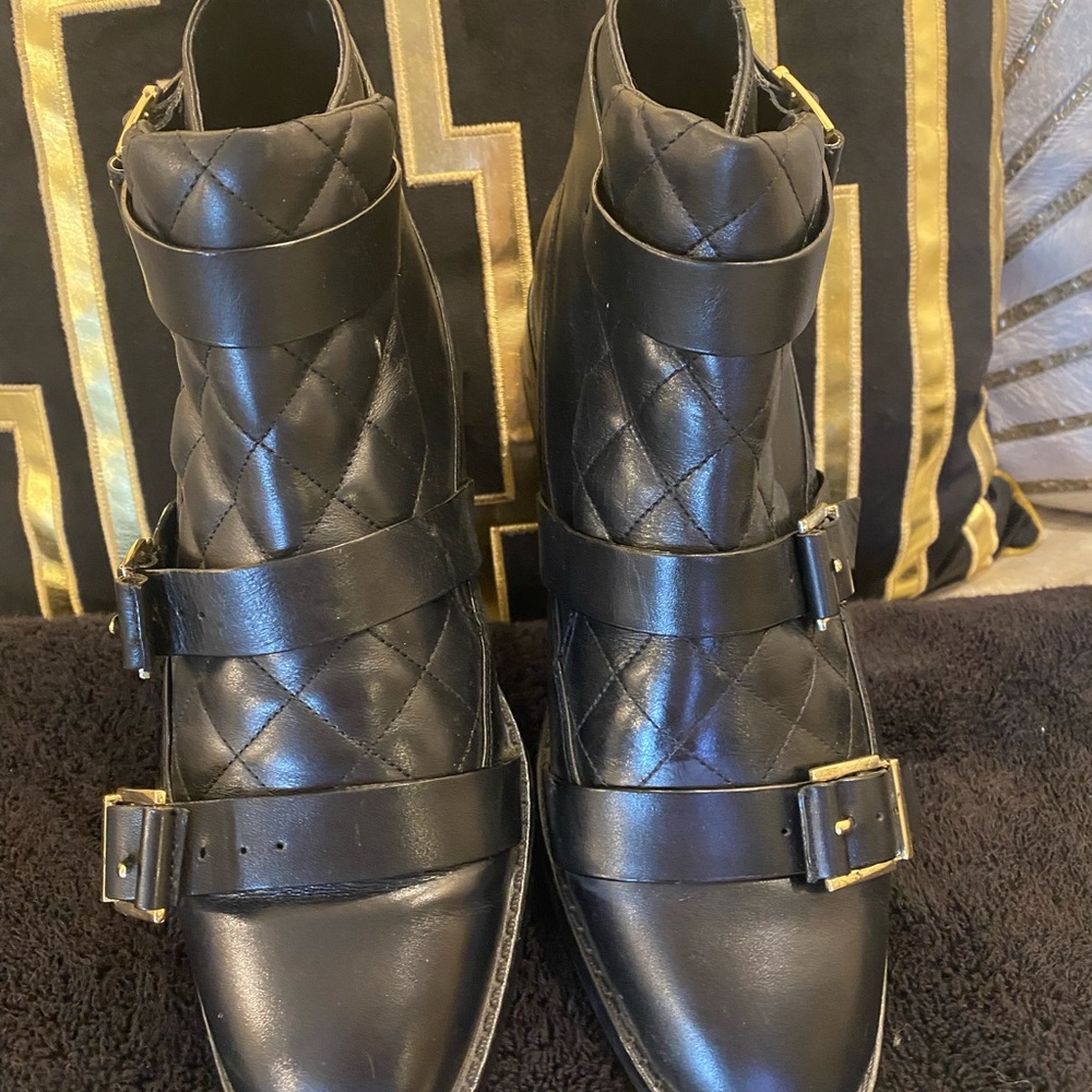 Zara black / gold three buckle quilted leather flat bootie.